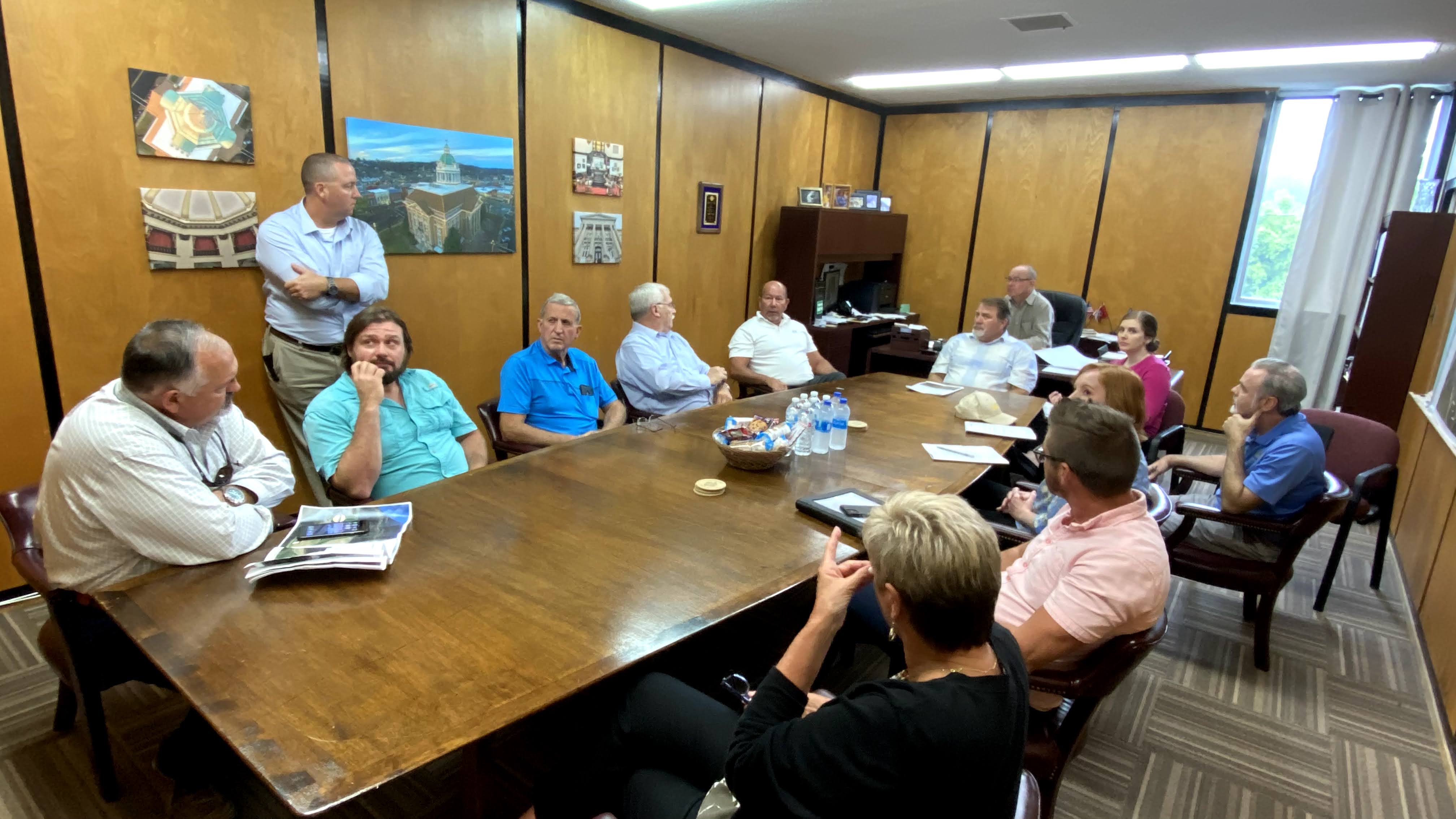 people sitting around conference table